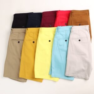 Flat lay of colorful men's shorts in different styles and colors, ideal for summer fashion.