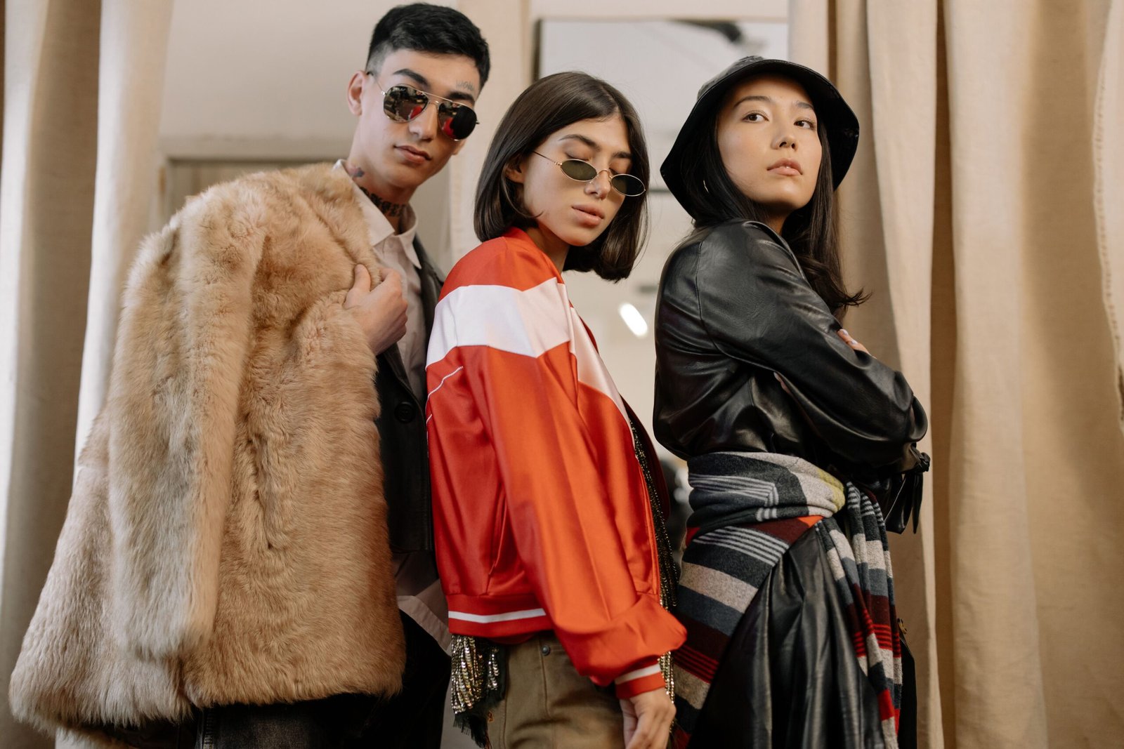 pexels photo 6069766 6069766 Three adults in fashionable attire posing confidently, reflecting retro and vintage styles.